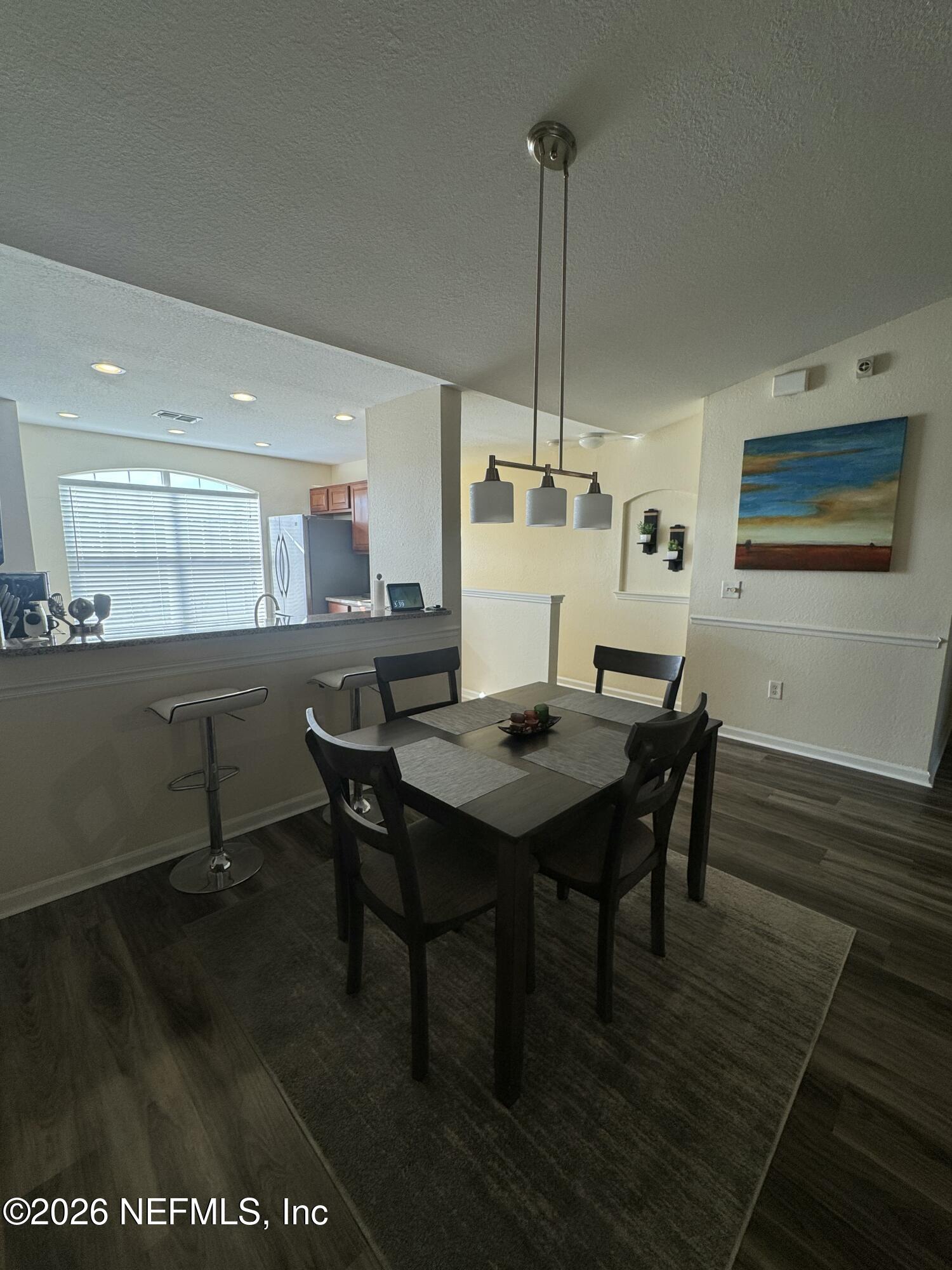 10200 Belle Rive Boulevard, Unit 3603 Jacksonville, FL 32256 - Photo 16 of 19 a view of a dining room with furniture