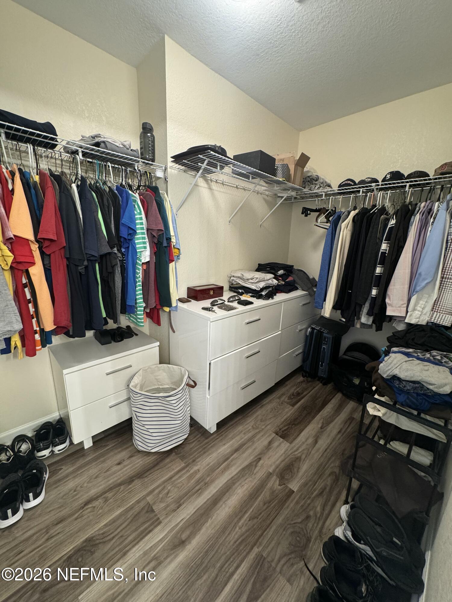 10200 Belle Rive Boulevard, Unit 3603 Jacksonville, FL 32256 - Photo 19 of 19 a view of walk in closet with clothes and shoes