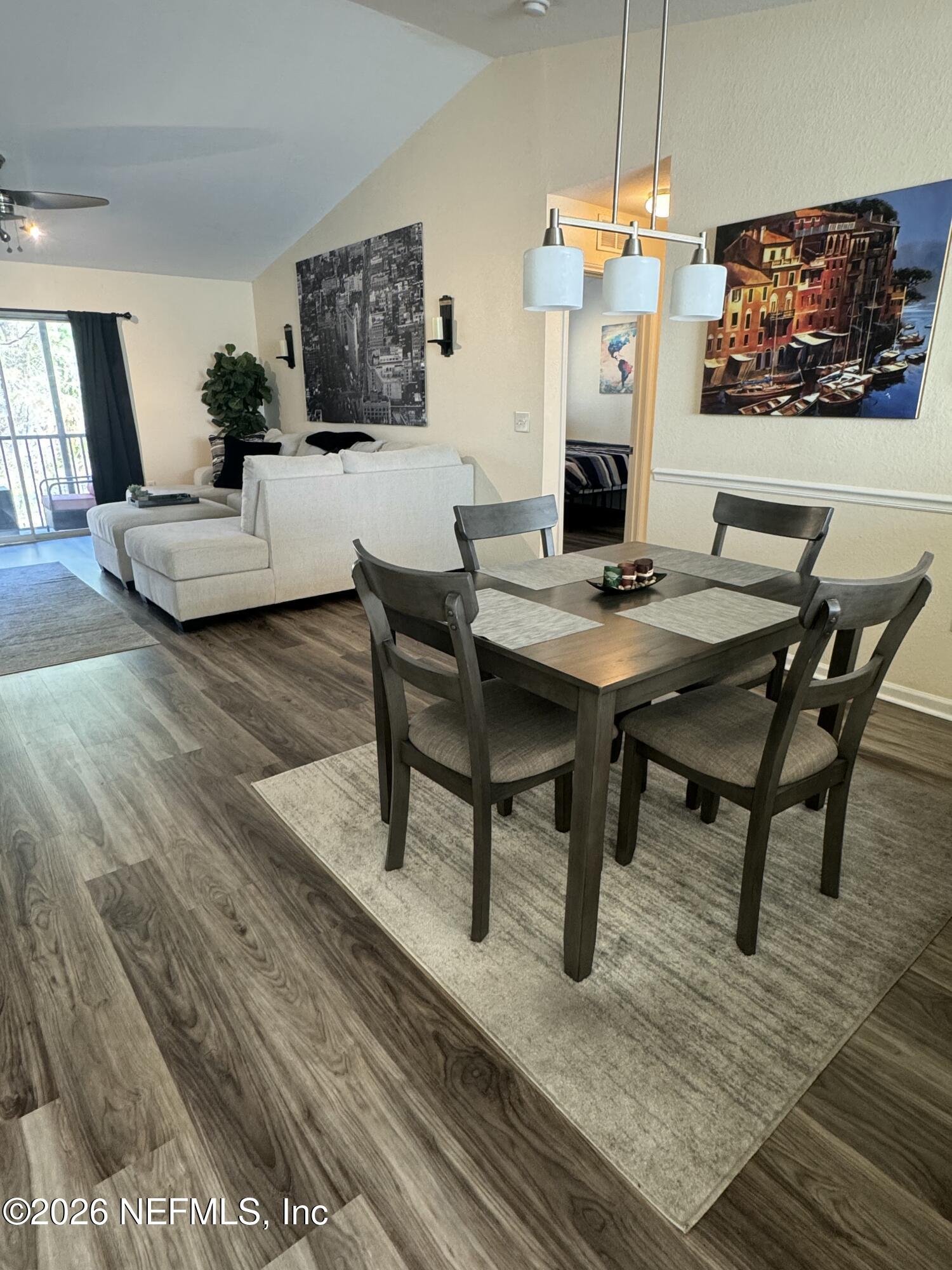 10200 Belle Rive Boulevard, Unit 3603 Jacksonville, FL 32256 - Photo 2 of 19 a view of a dining room with furniture