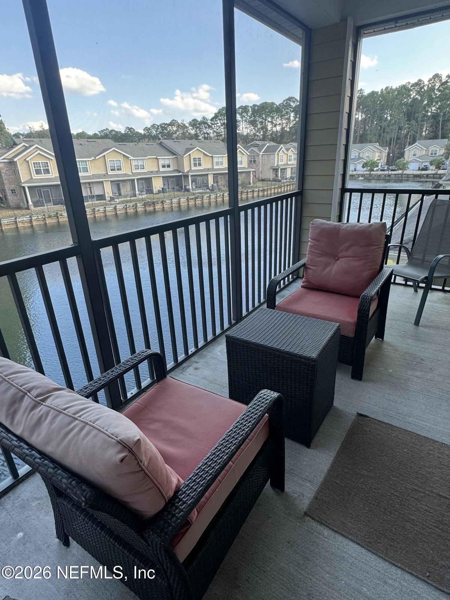 10200 Belle Rive Boulevard, Unit 3603 Jacksonville, FL 32256 - Photo 3 of 19 a view of a balcony with furniture