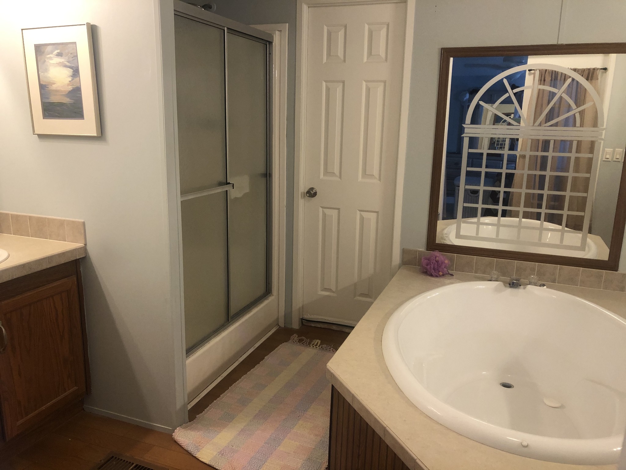 8063 Galen Road Lafayette, TN 37083 - Photo 16 of 18 a bathroom with a tub and shower