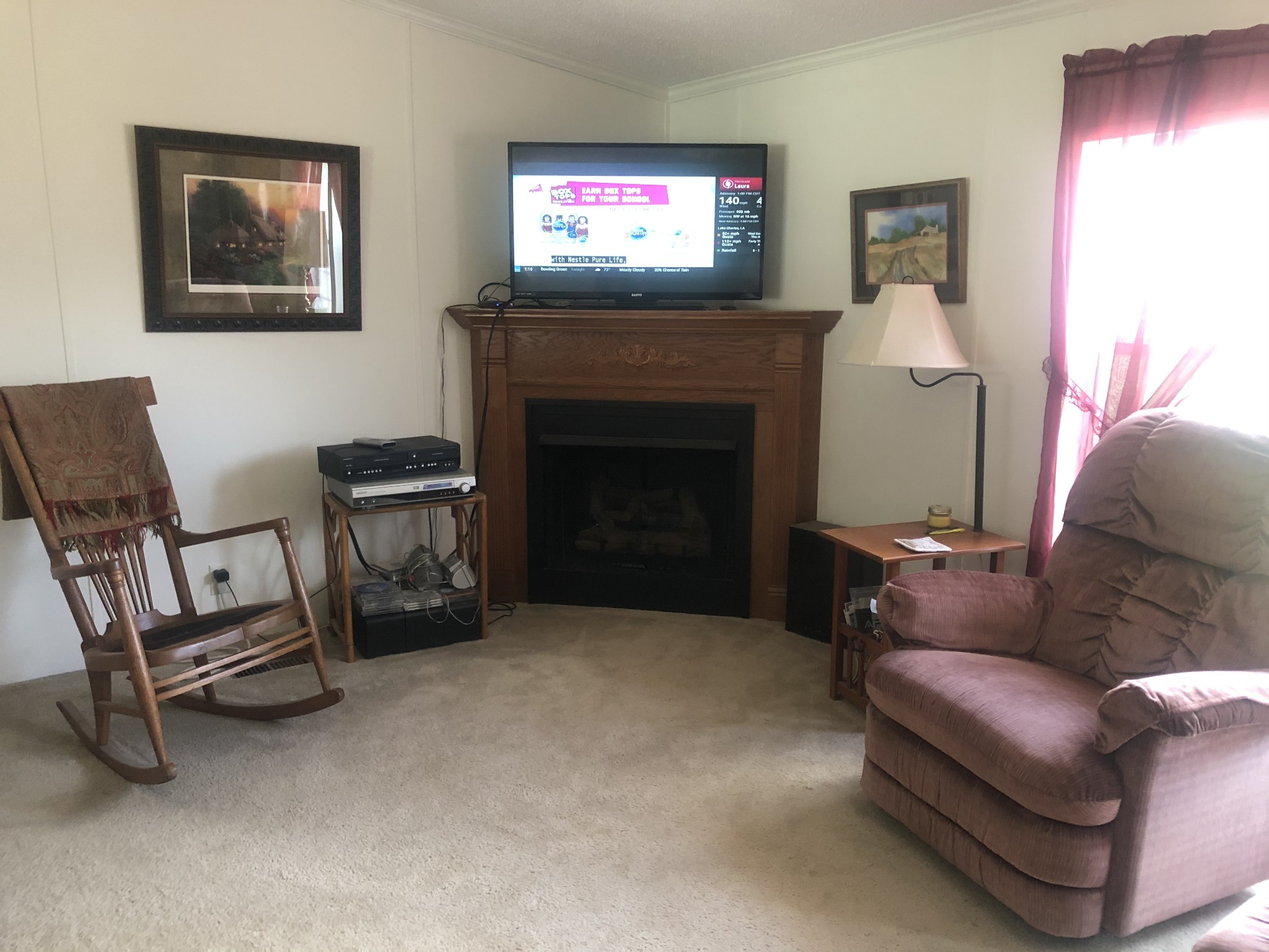 8063 Galen Road Lafayette, TN 37083 - Photo 9 of 18 a living room with furniture and a fireplace
