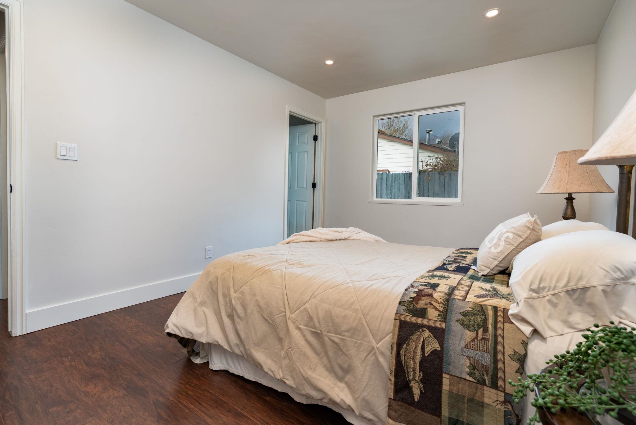 411 Cedar Glen Way Fruita, CO 81521 - Photo 11 of 25 a bedroom with a bed and a window