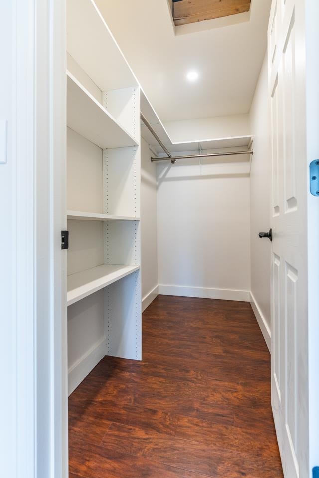 411 Cedar Glen Way Fruita, CO 81521 - Photo 13 of 25 a view of an empty walk in closet with wooden floor