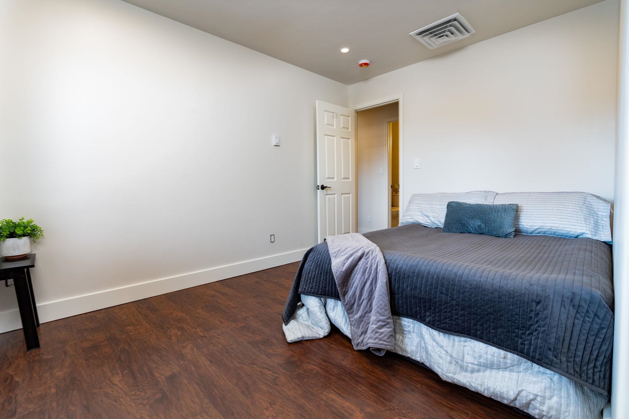 411 Cedar Glen Way Fruita, CO 81521 - Photo 16 of 25 a bedroom with a bed and a window