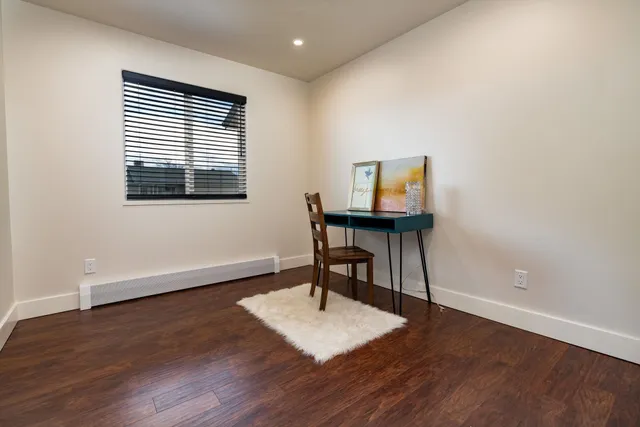 a workspace with furniture and a window