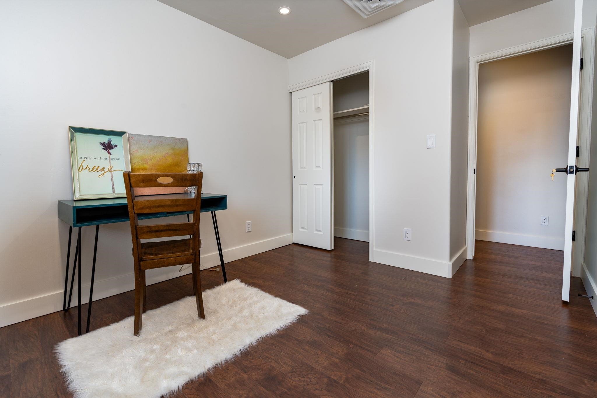 411 Cedar Glen Way Fruita, CO 81521 - Photo 18 of 25 a room with wooden floor and furniture