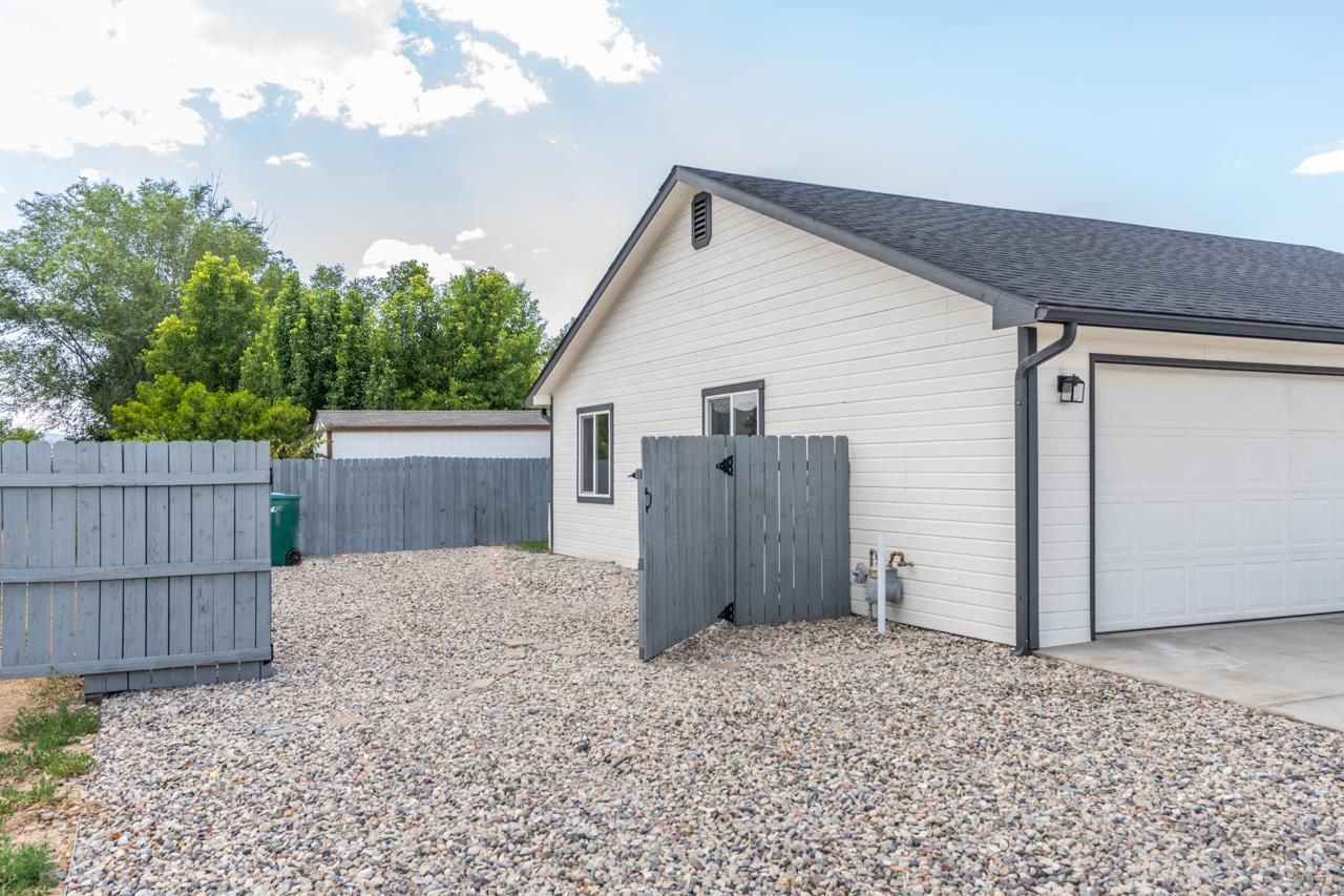 411 Cedar Glen Way Fruita, CO 81521 - Photo 23 of 25 a view of backyard of house with wooden fence
