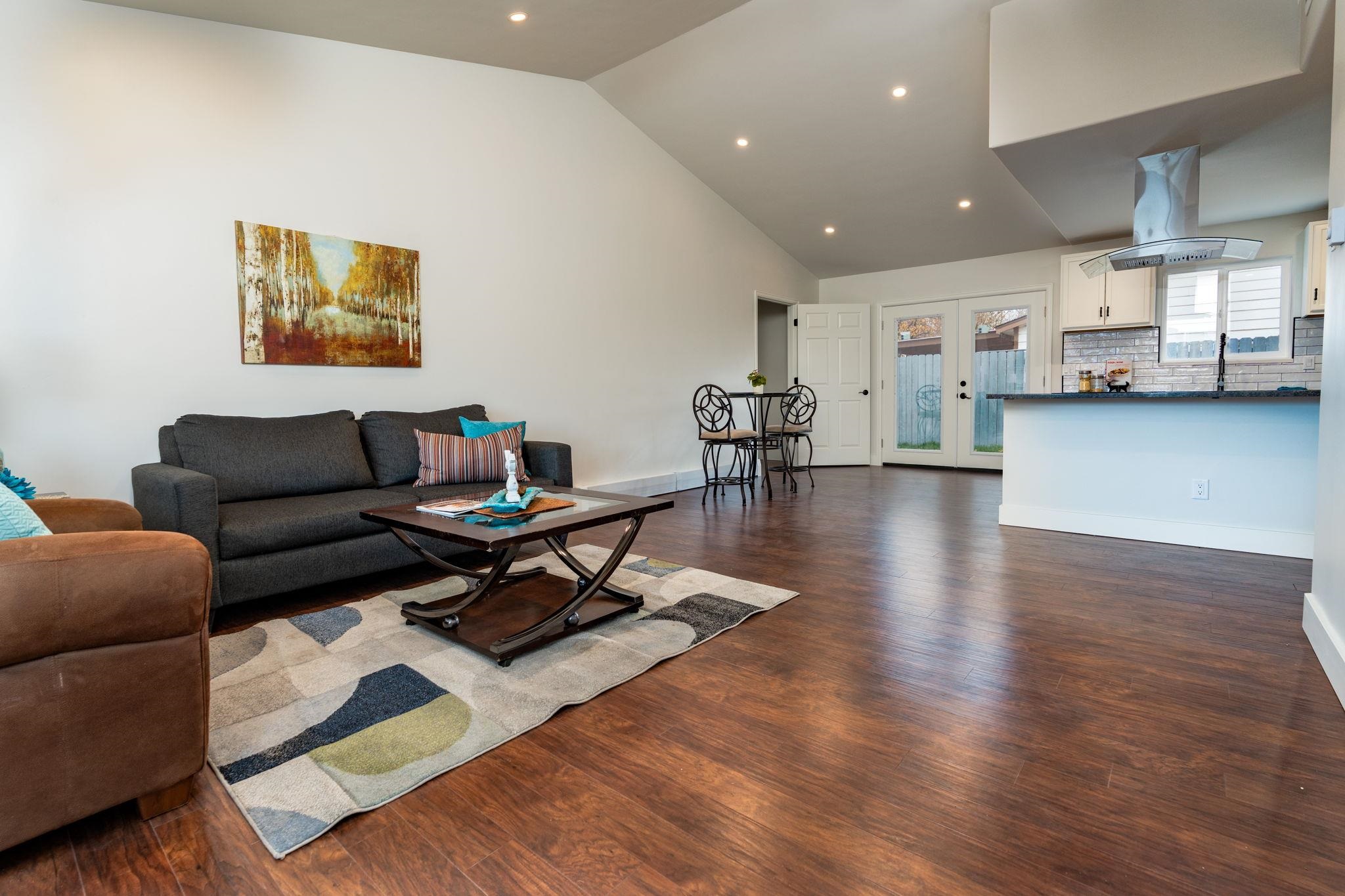 411 Cedar Glen Way Fruita, CO 81521 - Photo 3 of 25 a living room with furniture and a wooden floor