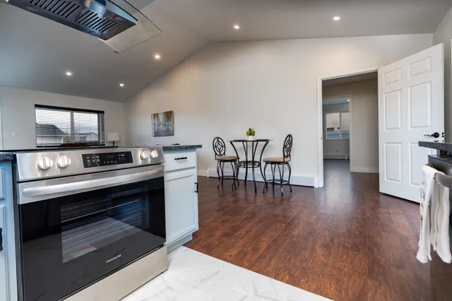 a kitchen with sink microwave and stove