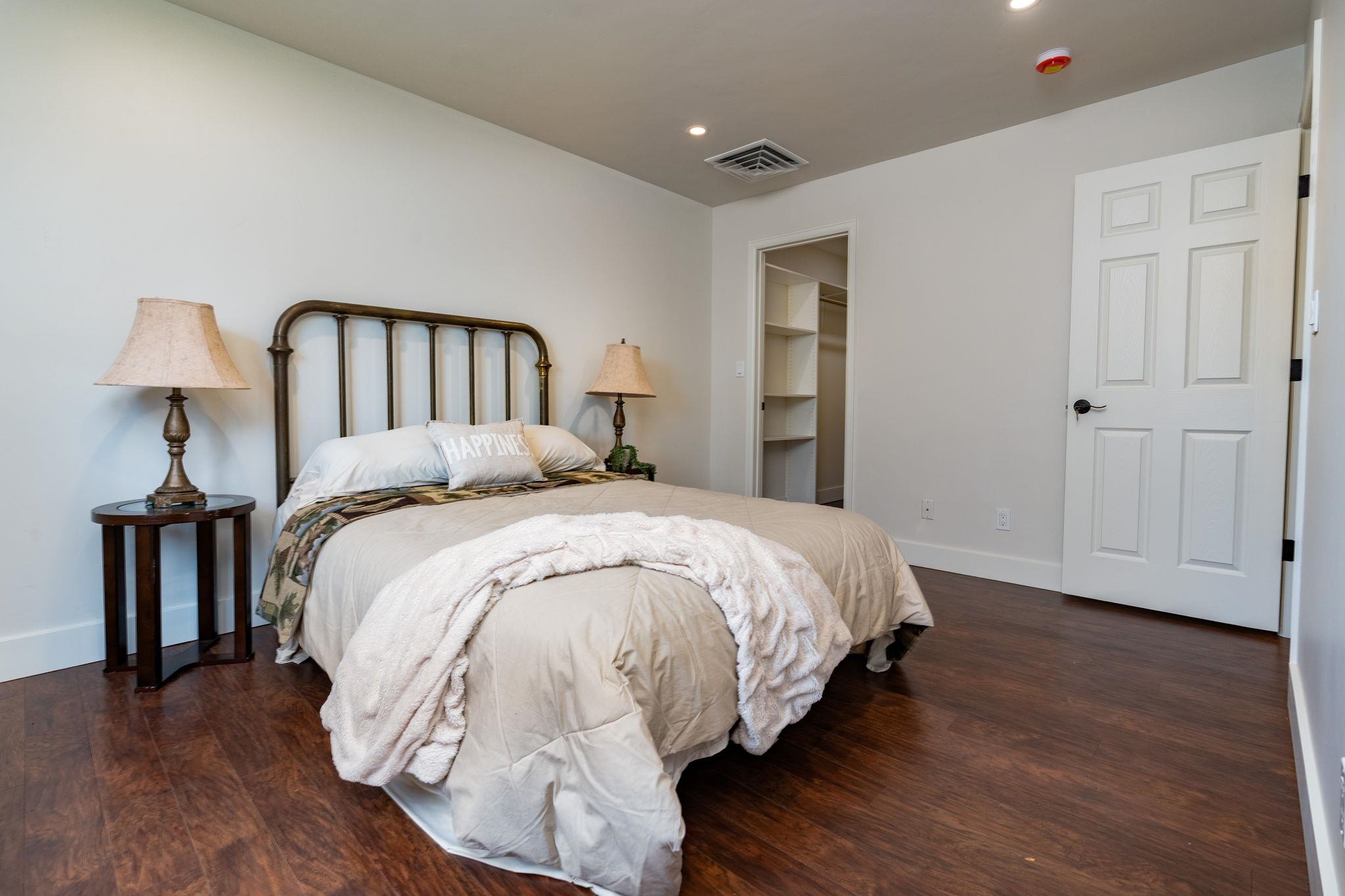 411 Cedar Glen Way Fruita, CO 81521 - Photo 10 of 25 a bed sitting in a bedroom next to a window