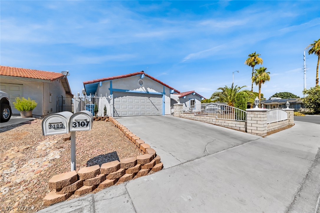 3107 Trueno Road Henderson, NV 89014 - Photo 1 of 37 A well-maintained stucco residence offers an attached garage and a neatly landscaped front yard with a concrete driveway.