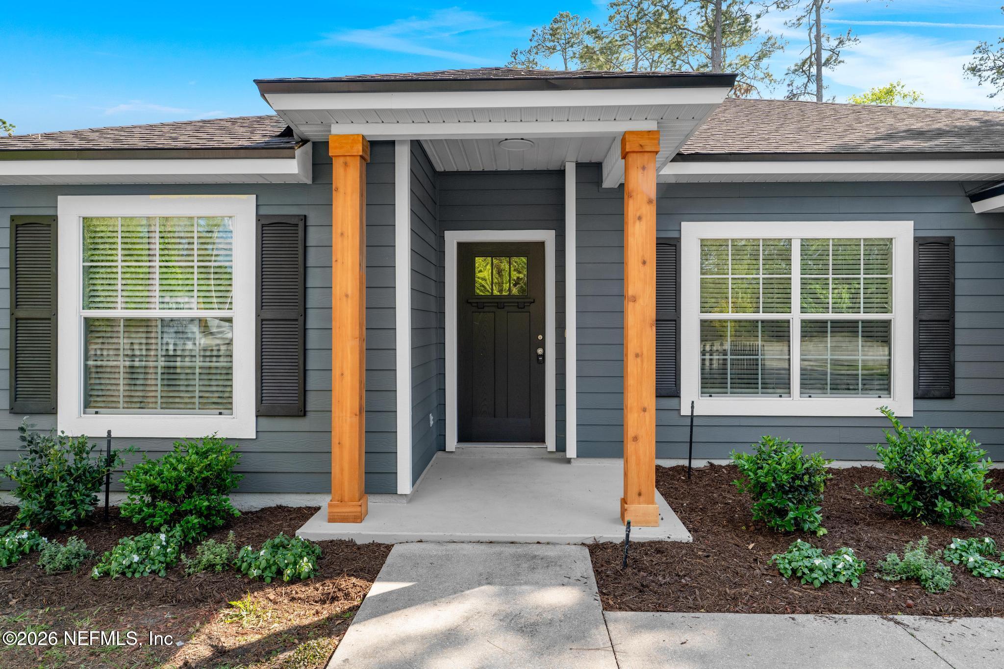 a front view of a house with porch