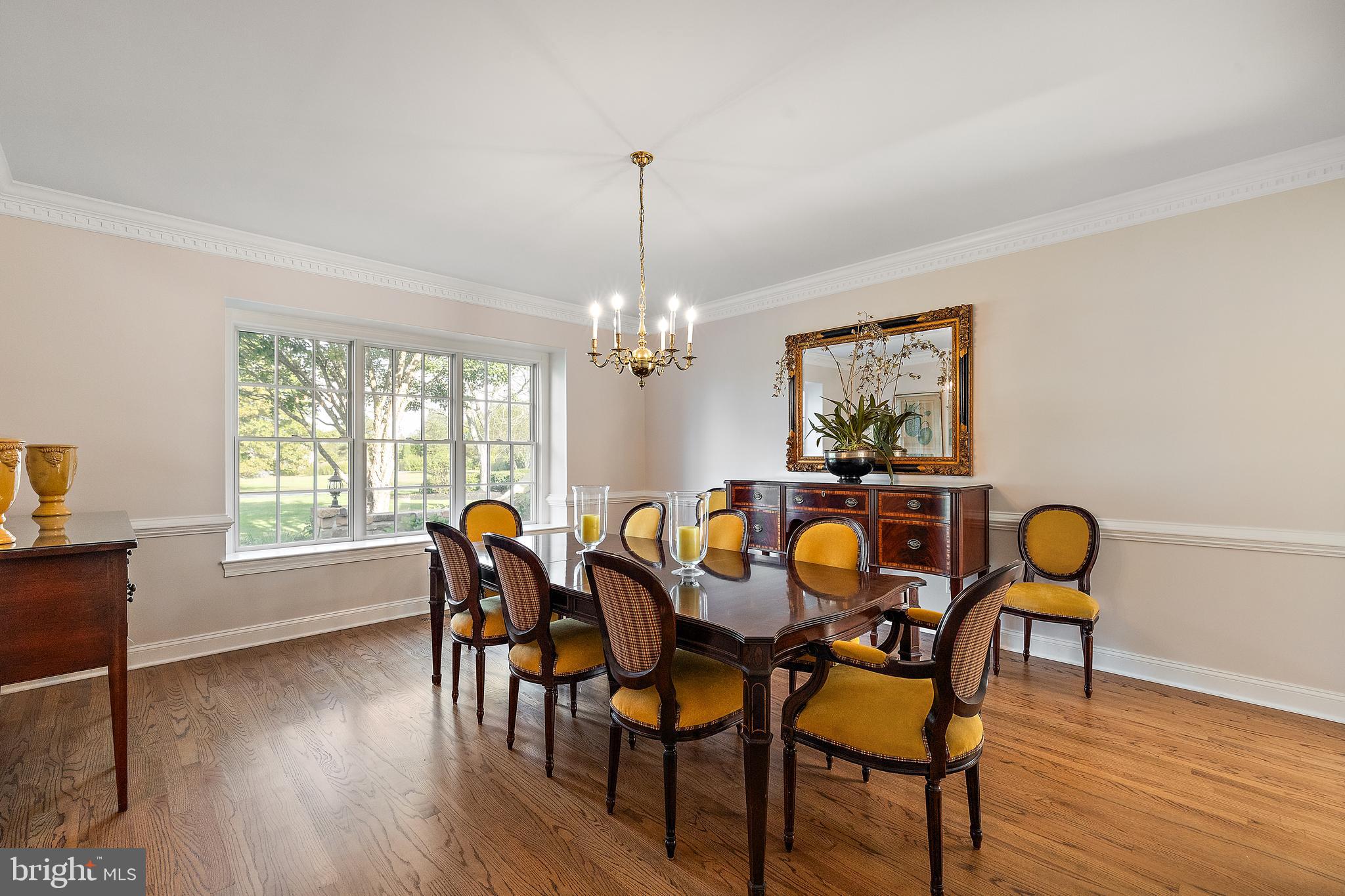 10 Pheasants Ridge North Wilmington, DE 19807 - Photo 21 of 69 a dining room with furniture a chandelier and wooden floor