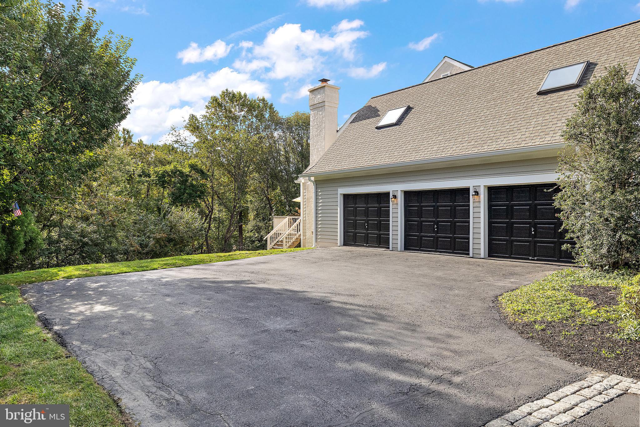 10 Pheasants Ridge North Wilmington, DE 19807 - Photo 58 of 69 a front view of a house with a yard and garage
