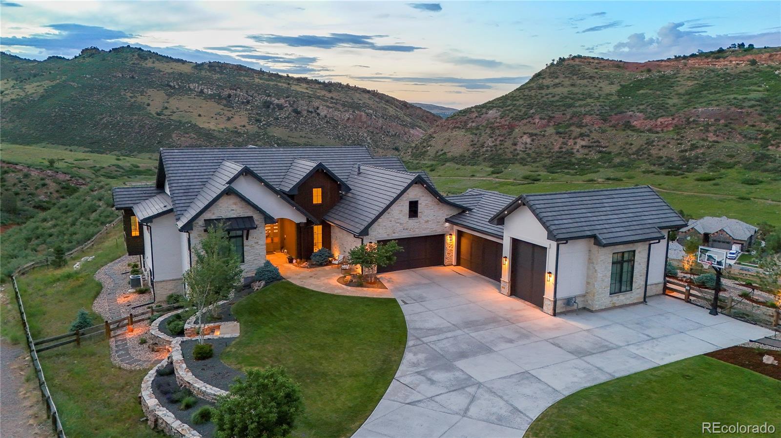 15411 Dinosaur Ridge Road Morrison, CO 80465 - Photo 1 of 50 an aerial view of a house with a big yard