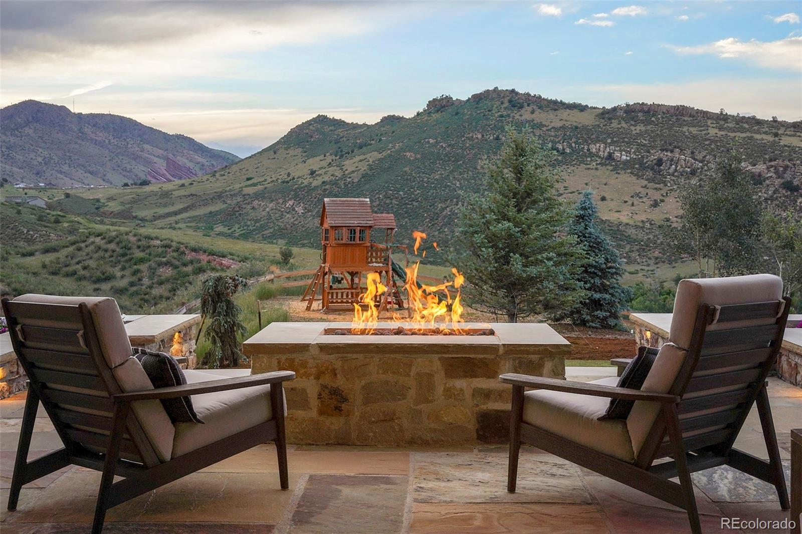 15411 Dinosaur Ridge Road Morrison, CO 80465 - Photo 39 of 50 a view of a chairs and table in the terrace