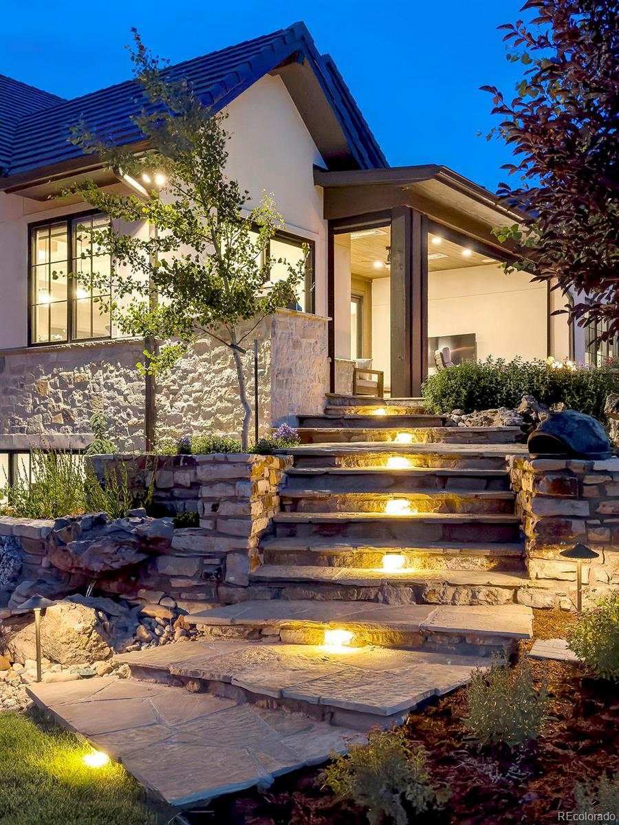 15411 Dinosaur Ridge Road Morrison, CO 80465 - Photo 41 of 50 a front view of a house with a yard