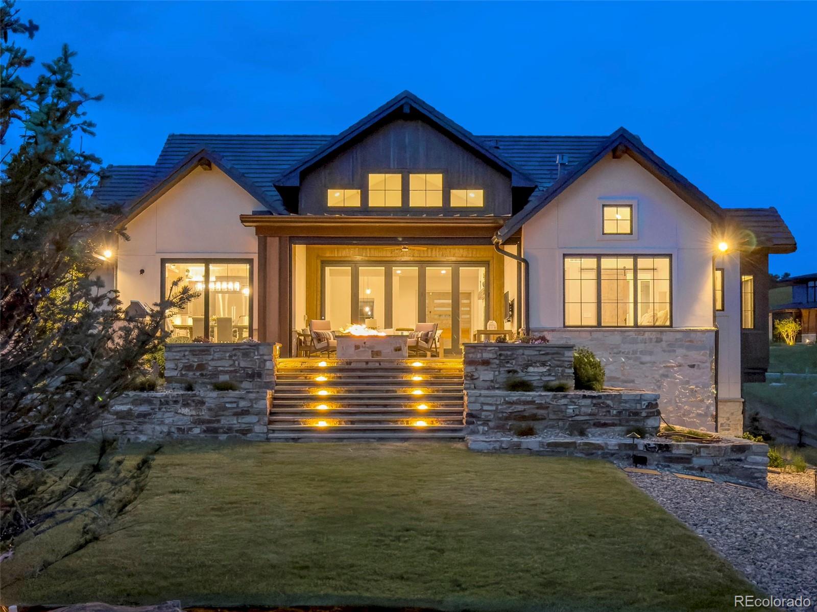 15411 Dinosaur Ridge Road Morrison, CO 80465 - Photo 42 of 50 a front view of a house with yard and green space