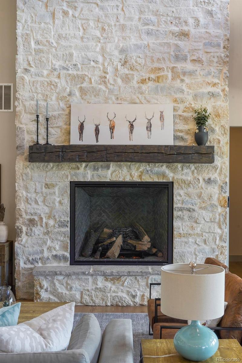 15411 Dinosaur Ridge Road Morrison, CO 80465 - Photo 6 of 50 a white building with a fireplace