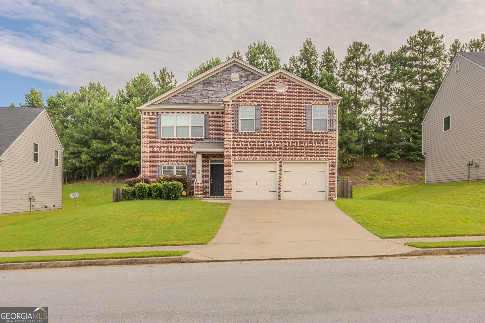 1180 Lehavre Court Hampton, GA 30228 - Photo 2 of 43 a front view of a house with a yard and garage