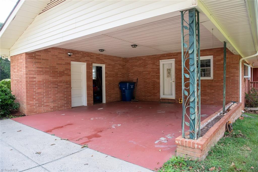 207 Forest Drive Graham, NC 27253 - Photo 10 of 34 2 Car Carport. Note Storage Rooms.
