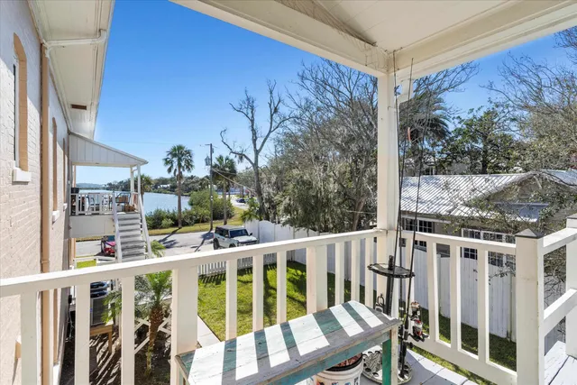 a view of balcony with furniture