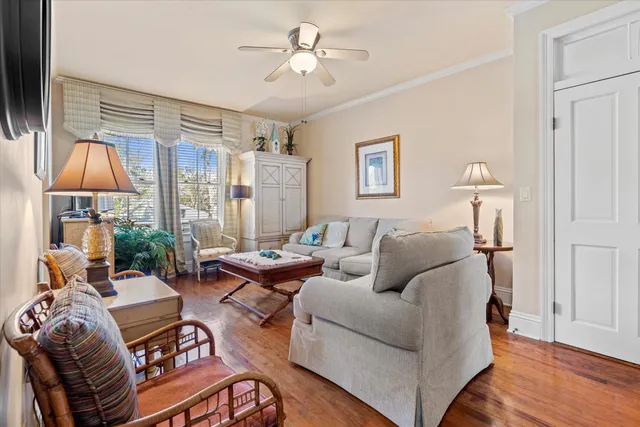 a living room with furniture and a lamp