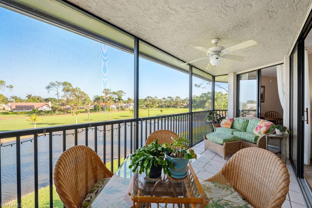 415 Augusta Boulevard, Unit 309 Naples, FL 34113 - Photo 2 of 36 a living room with furniture and a large window