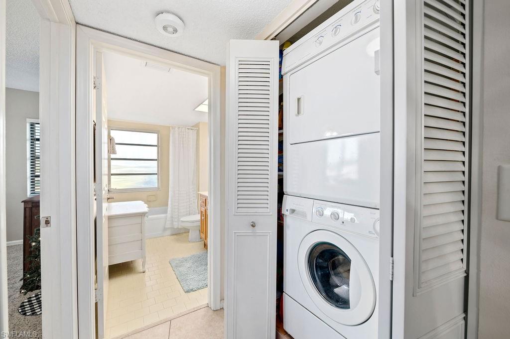 415 Augusta Boulevard, Unit 309 Naples, FL 34113 - Photo 22 of 36 a view of a hallway with washer and dryer