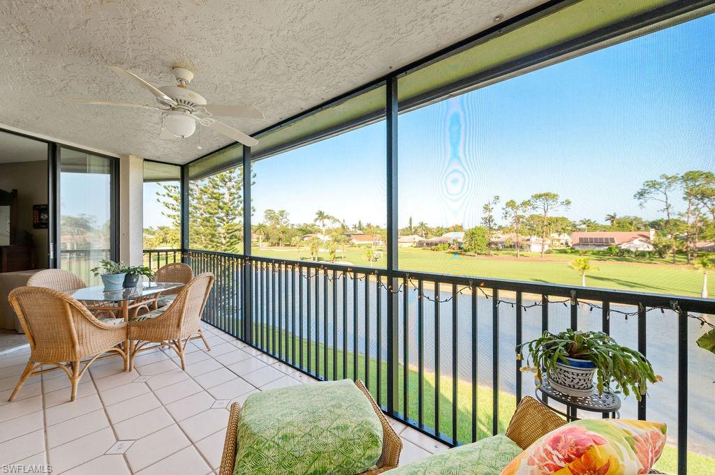 415 Augusta Boulevard, Unit 309 Naples, FL 34113 - Photo 25 of 36 a balcony with furniture and city view