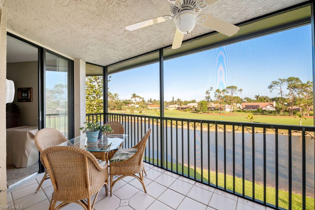 415 Augusta Boulevard, Unit 309 Naples, FL 34113 - Photo 26 of 36 a balcony with furniture