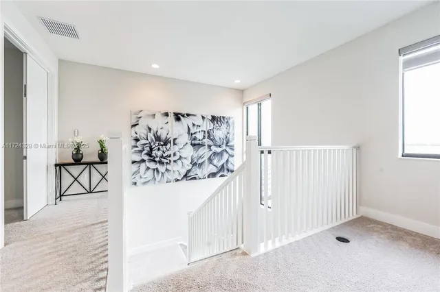 a view of entryway with white walls