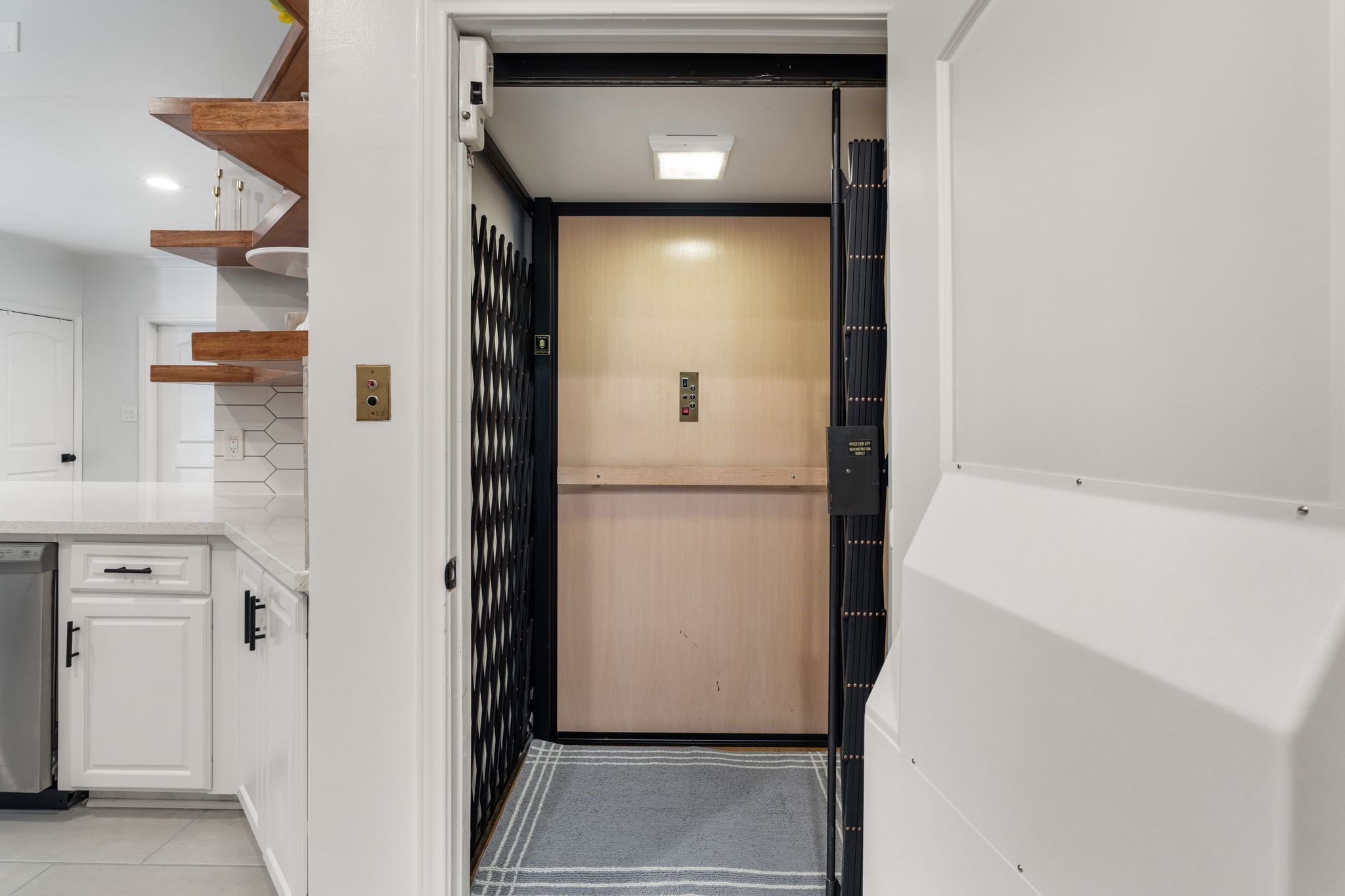 201 Vanderpool Lane, Unit 137 Houston, TX 77024 - Photo 18 of 42 The elevator is located right off of the kitchen and provides convenient access to all three floors, adding everyday ease and functionality throughout the home.