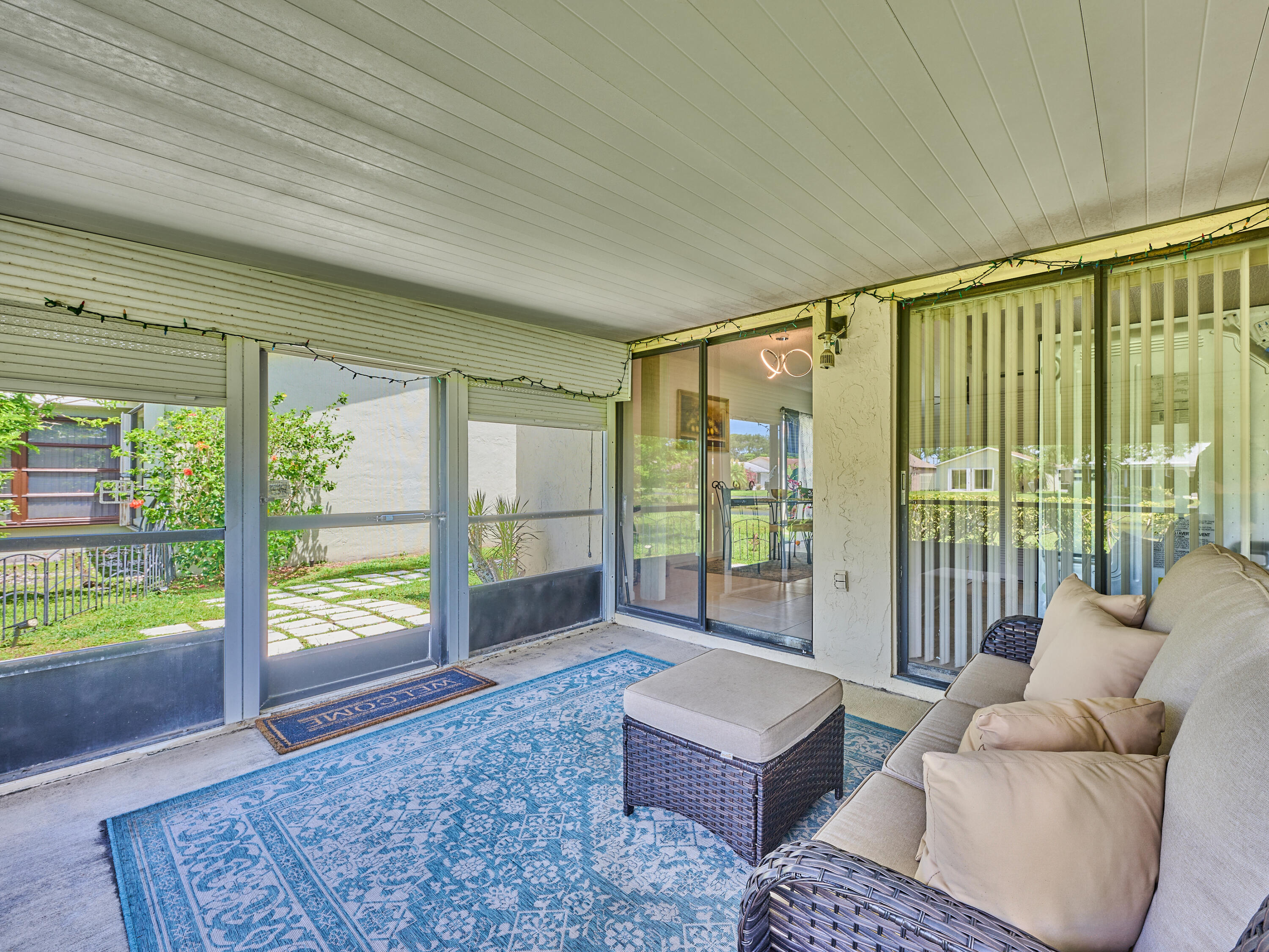 5197 Minto Road Boynton Beach, FL 33472 - Photo 24 of 32 a living room with furniture and a floor to ceiling window