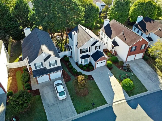 an aerial view of a house with outdoor space