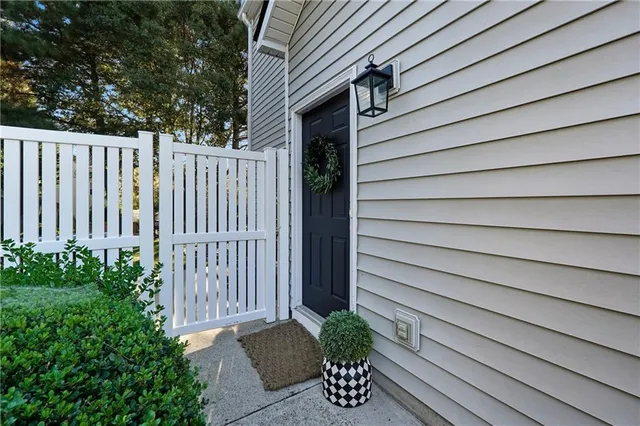 a view of backyard of house with outdoor seating