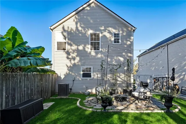 an aerial view of residential house with outdoor space and trees