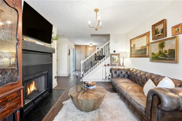 a living room with furniture or flat screen tv and a fireplace