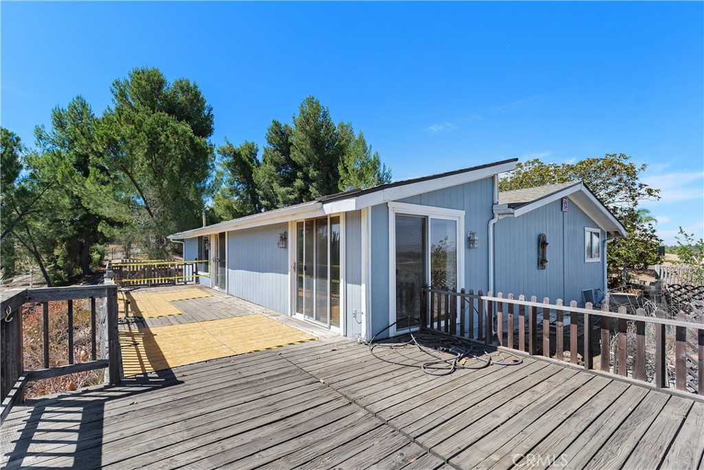 34881 Los Nogales Road Temecula, CA 92592 - Photo 13 of 50 Large wooden deck needs repairs but offers an additional outdoor living space with views!