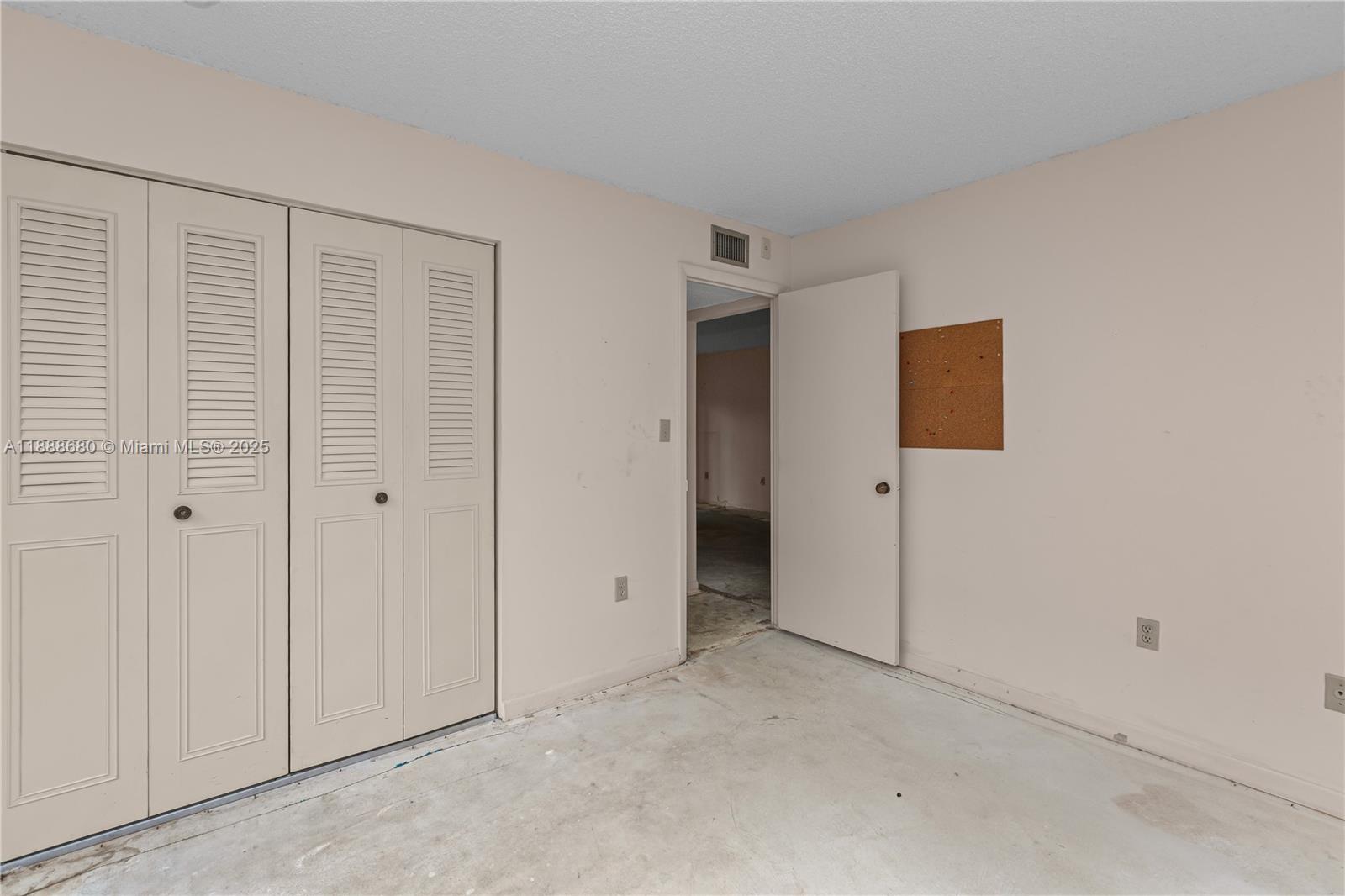 8277 Southwest 128th Street, Unit 108 Pinecrest, FL 33156 - Photo 17 of 34 a view of an empty room