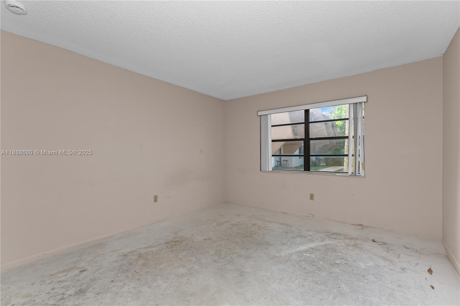 8277 Southwest 128th Street, Unit 108 Pinecrest, FL 33156 - Photo 19 of 34 an empty room with windows