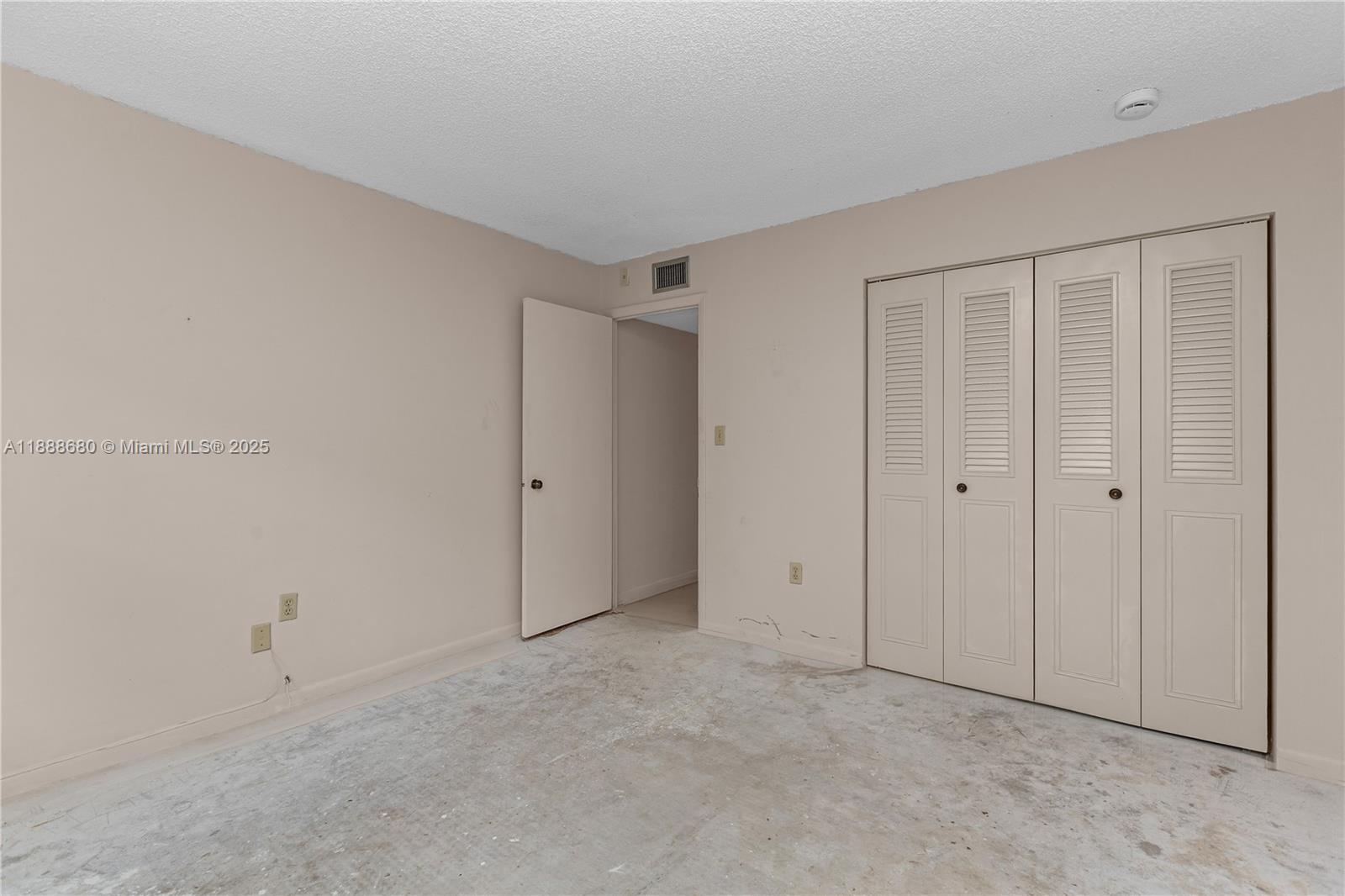 8277 Southwest 128th Street, Unit 108 Pinecrest, FL 33156 - Photo 20 of 34 a view of an empty room
