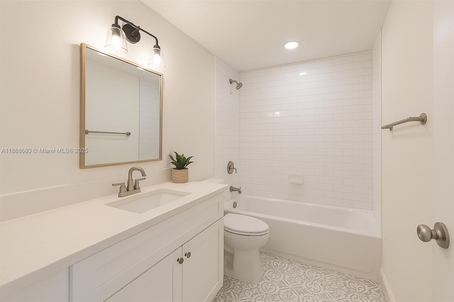 8277 Southwest 128th Street, Unit 108 Pinecrest, FL 33156 - Photo 22 of 34 a bathroom with a sink a toilet and shower