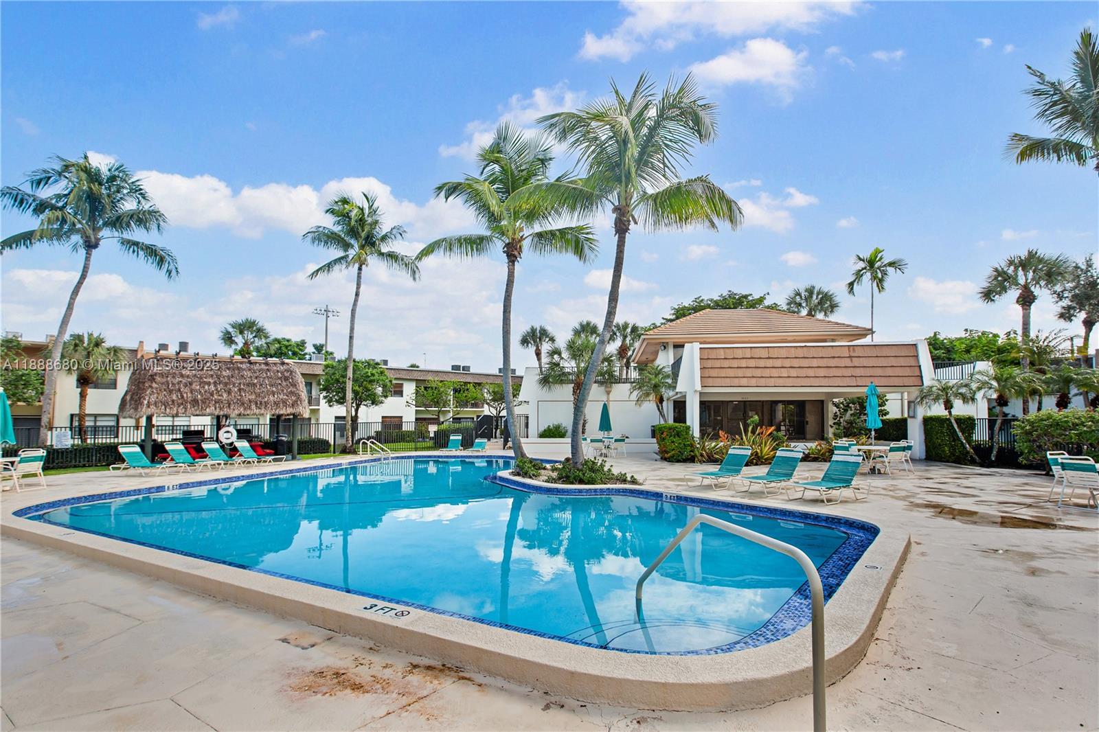 8277 Southwest 128th Street, Unit 108 Pinecrest, FL 33156 - Photo 28 of 34 a view of a swimming pool with a patio