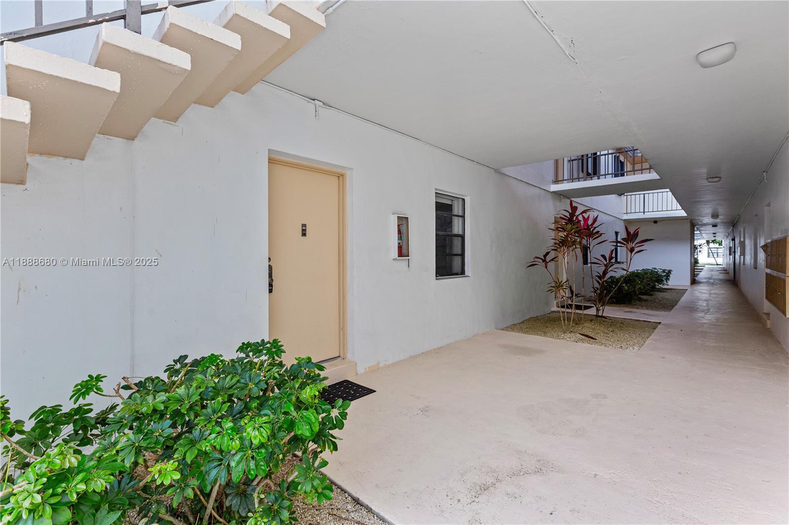 8277 Southwest 128th Street, Unit 108 Pinecrest, FL 33156 - Photo 33 of 34 a view of livingroom with furniture and a potted plant