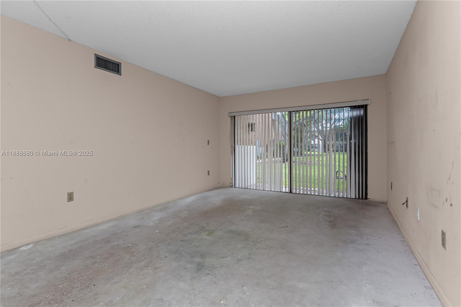 8277 Southwest 128th Street, Unit 108 Pinecrest, FL 33156 - Photo 5 of 34 a view of an empty room with a balcony