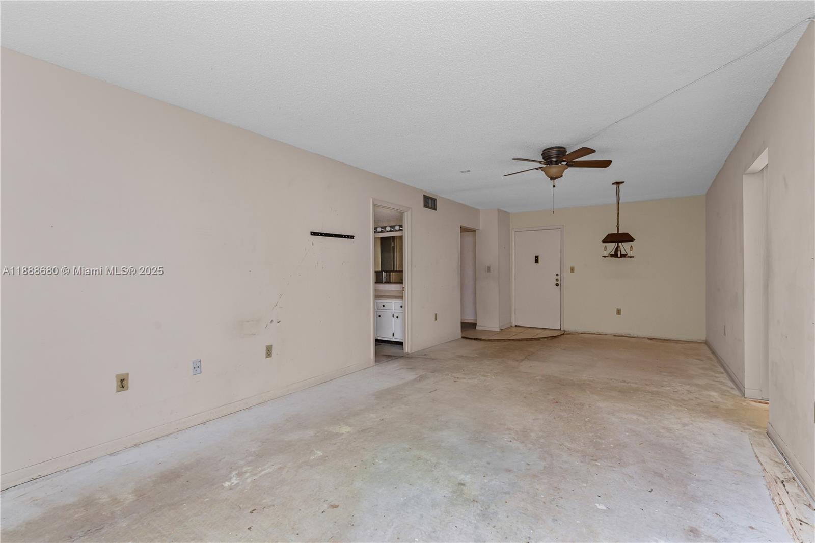 8277 Southwest 128th Street, Unit 108 Pinecrest, FL 33156 - Photo 7 of 34 a view of an empty room