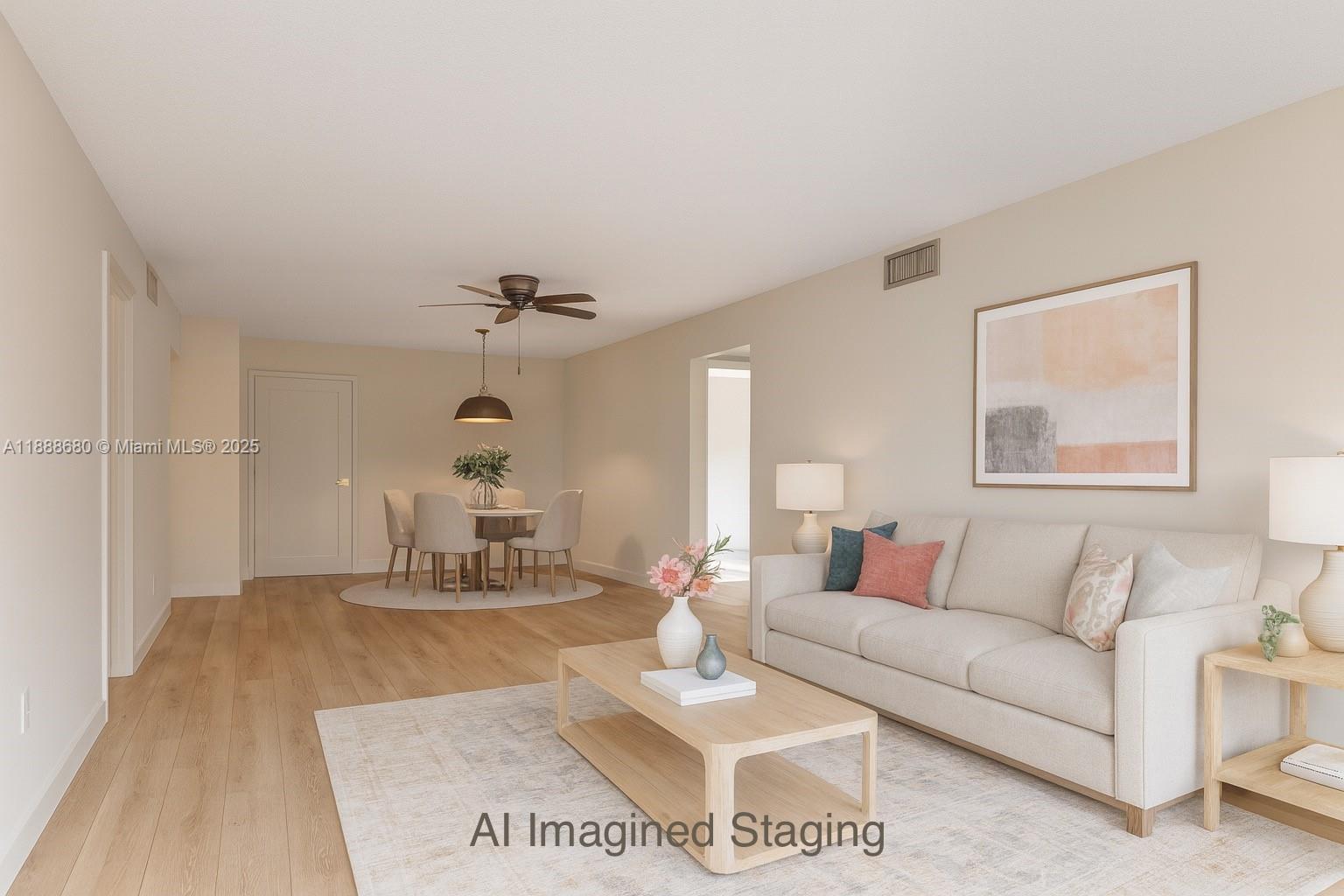 8277 Southwest 128th Street, Unit 108 Pinecrest, FL 33156 - Photo 8 of 34 a living room with furniture and a chandelier