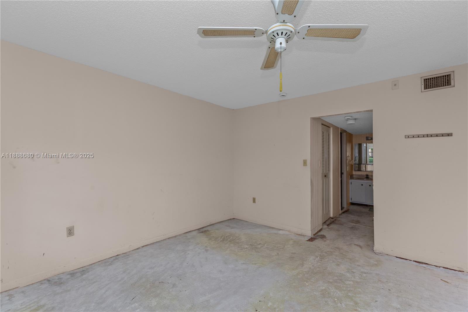 8277 Southwest 128th Street, Unit 108 Pinecrest, FL 33156 - Photo 9 of 34 a view of an empty room